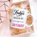 Bela šolja sa natpisom Kraljice dolaze na svet u oktobru